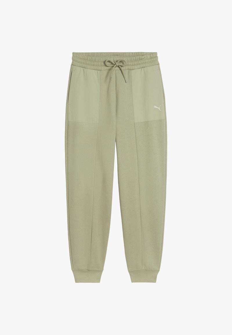 Pantalones de chándal verde claro con cinturilla elástica, cordón y bolsillos laterales. Presenta un diseño bicolor y un pequeño detalle del logo en una pierna.