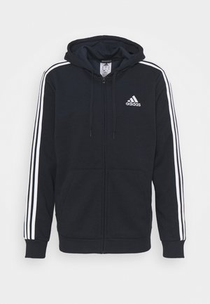 Schwarzer Adidas-Zip-Hoodie mit weißen drei Streifen auf den Ärmeln und Adidas-Logo auf der linken Brust, mit Kordelzugkapuze und Vordertaschen.