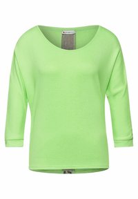 Ljusgrön, långärmad topp i en strukturerad tyg. Har en bred rundad halsringning och en avslappnad passform. Inga tydliga mönster eller detaljer.