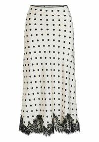 Jupe à pois crème avec des pois noirs, dotée d'un ourlet en dentelle noire festonné. Tissu lisse, coupe ajustée, longueur au genou.