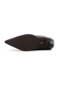 Black leather high-heeled shoe with a pointed toe and a textured sole. Features a subtle gold accent on the heel. Smooth surface and sleek design.
