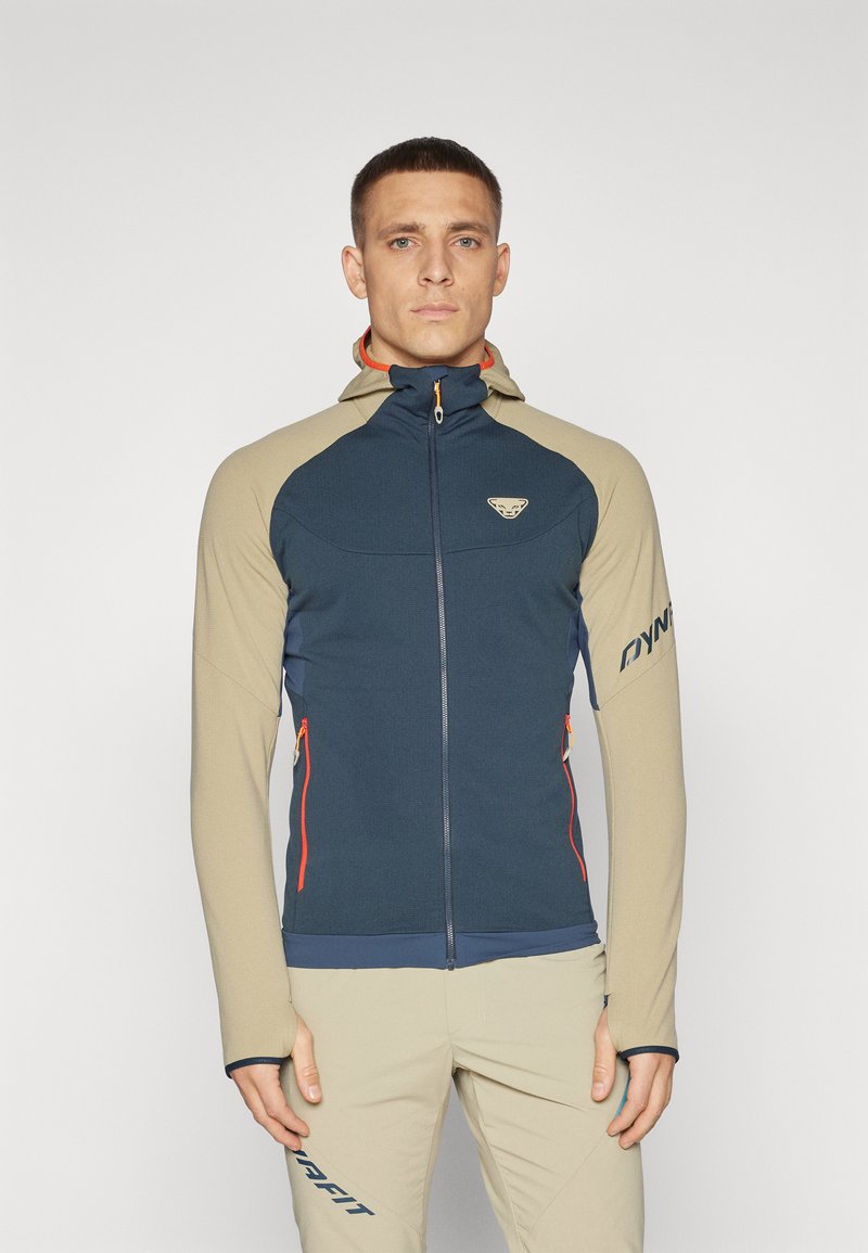 Hooded jacket featuring a navy body with beige sleeves and orange accents, two front zip pockets, and a logo on the chest.