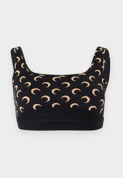 Μαύρο αθλητικό σουτιέν με μπεζ σχέδια σε σχήμα ημισελήνου και φαρδιές τιράντες, με μαύρη ελαστική ταινία στο κάτω μέρος.