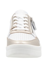 White sneaker with metallic gold accents, perforated upper, flat laces, side zipper, and white rubber sole for a modern look.
