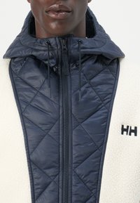 Helly Hansen STOWE HOODED HYBRID JACKET UNISEX - Zimní bunda - navy