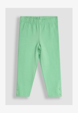 Mündroheline leggins pehmest ja venivast kangast. Omab elastset vööd ja kahte dekoratiivset nööpi allääres.