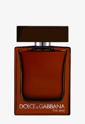 Flacon de parfum en verre marron avec un grand bouchon rectangulaire marron foncé et le texte "Dolce & Gabbana the one" sur le devant.