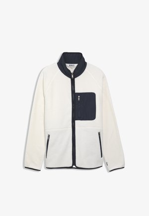 Fleecejack voor in het wit met marineblauwe accenten. Voorzien van een ritszak op de borst, zijzakken en een hoge kraag. Zachte textuur, raglanmouwen.