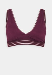 Møtt bralette med dyp V-utringning, brede stropper og en kant med tre horisontale sølvstriper. Glatt tekstur.