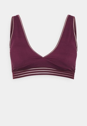 Maroon bralette with a deep V-neck, wide straps, and a band featuring three horizontal silver stripes. Smooth fabric texture.