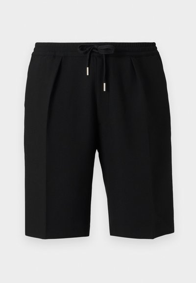 Black shorts made of soft fabric, featuring an elastic waistband with a drawstring, pleated front, and a knee-length cut.