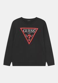 Svart hettegenser med grafikk i rødt som viser en triangel med teksten "GUESS U.S.A" og "WASHED JEANS", laget av mykt stoff og med rund hals.