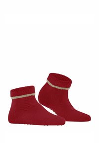 Rote Knöchelsocken mit einem weichen, strukturierten Bündchen und einem beigen Streifen. Die Sohle ist mit kleinen Gripp-Dots für besseren Halt versehen.