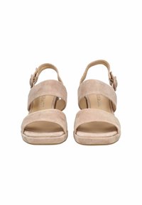 Sandali in suede beige con due cinturini larghi, design con punta aperta e cinturino alla caviglia regolabile con dettaglio a pulsante circolare.