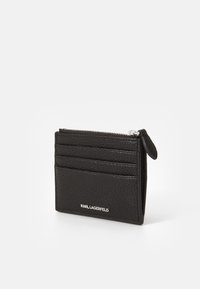 Black leather card holder with a textured surface, features four card slots and a zippered pocket, adorned with silver logo detailing.