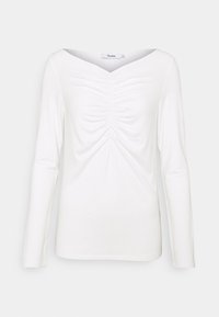 Bílý dlouhý rukáv top s výstřihem do V a řasením v přední části, vyrobený z měkkého, elastického materiálu, s přiléhavým střihem.