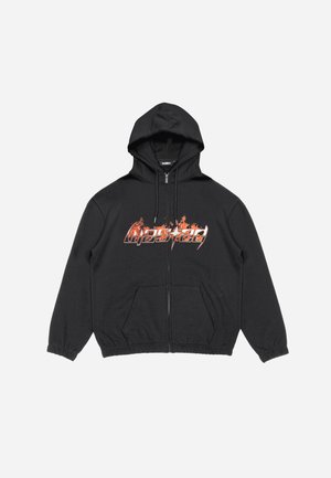 Black zip-up hoodie with a drawstring hood, front pockets, and bold red-orange graphic text design on the chest area. Soft fabric texture.