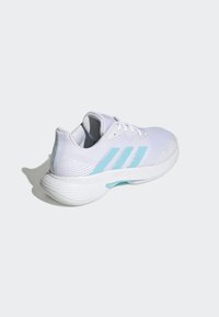 White athletic sneaker with a breathable mesh upper, light blue accents, three stripes, and a textured outsole. Lightweight and streamlined design.