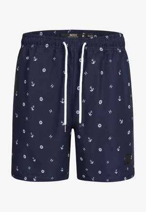 Mørkeblå svømmebukser med hvidt anker- og kompasmønster, elastisk talje og snorelukning. Glat tekstur, knælangt design.