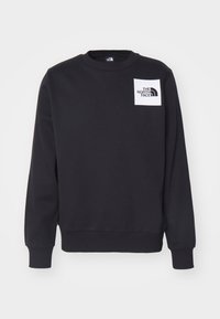 Svart sweatshirt med rund hals, ribbede mansjetter og kant. Har et hvitt kvadratisk merke med "THE NORTH FACE"-logoen på brystet.