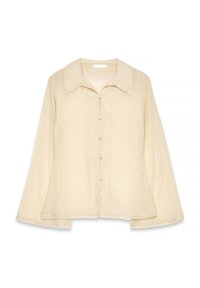 Camicia beige a maniche lunghe con colletto appuntito, chiusura con bottoni e tessuto testurizzato. L'orlo è leggermente curvo con una vestibilità rilassata.