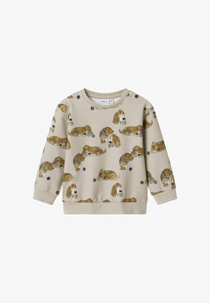 Šviesiai smėlinis džemperis su ilgomis rankovėmis, puikuojantis kartotiniais iliustracijų stiliaus šunų ir mėlynų bei rudų apskritimų raštais.