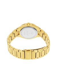 Goldfarbene Edelstahl-Uhr mit Gliederarmband, runder Gehäuseform und transparentem Rücken, der gravierte Details sowie eine Krone auf der Position 2 Uhr zeigt.