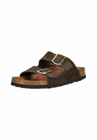 Brune ruskindsandal med to justerbare stropper og metalspænder. Korkfodbede med struktureret sort gummisål for godt greb. Bredt, åbent design.