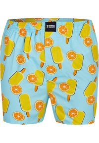 Pantaloni corti blu con un motivo di ghiaccioli gialli e fette d'arancia, realizzati in tessuto leggero con una vita elastica.