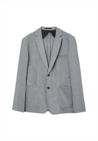 Hellgrauer Blazer aus weichem Material, verfügt über zwei Vorderaschen, einen Ein-Knopf-Verschluss und Reverskragen. Die Innenseite ist in Marineblau.