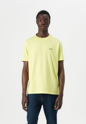 Light yellow short-sleeve T-shirt made of soft cotton, featuring a crew neck and a small black "BOSS" logo on the chest.