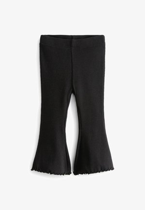 Zwarte geribde leggings met uitlopende broekspijpen, gemaakt van een rekbare stof met ruche aan de onderkant. Glad oppervlak en slim fit ontwerp.