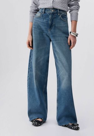 - Jeansy Relaxed Fit