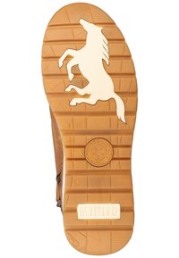 Bruine rubberen zool met de silhouet van een galopperend paard en de merknaam 'MUSTANG' gegraveerd. Ge текстureerd voor grip met gedefinieerde groeven. Maat 47.