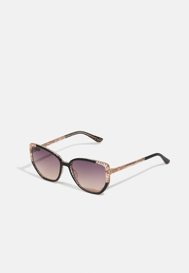 Black and glitter-accented sunglasses with a square frame and gradient purple lenses. Textured arms with gold sparkles blend into the black finish.