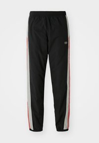 Black athletic pants with elastic waist, featuring side stripes in gray and red, lightweight material, and a logo on the upper left leg.