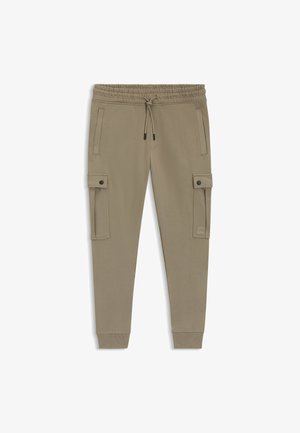 Pantaloni cargo beige con vita elastica, chiusura con cordino, tasche laterali e tasche cargo su entrambe le gambe. Tessuto liscio, polsini aderenti.