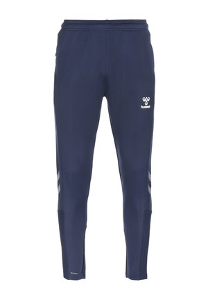 Marineblauwe taps toelopende sportbroek met elastische taille, reflecterende chevronstrepen aan de zijkanten en wit hummel-logo op het bovenbeen.