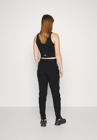 adidas Performance FAST PANT - Träningsbyxor - black