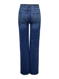 Mėlynos spalvos platėjančios kelnės iš džinsinio audinio su aukštu liemeniu, turinčios dvi galines kišenes ir subtilų blukimą. Audinys yra lygios tekstūros.