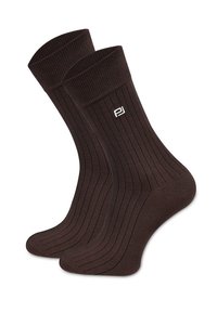 Brązowe skarpetki dziane z fakturą prążkowaną, z haftowanym białym logo. Zaprojektowane w długości do połowy łydki.