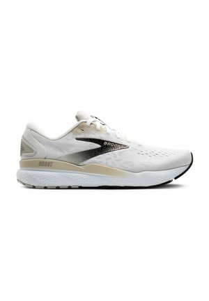 White running shoe with a mesh upper, black and silver accents, padded collar, and a textured rubber sole. Model name "Brooks Ghost" visible.