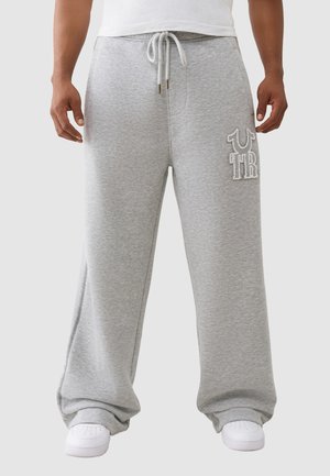 - Spodnie materiałowe