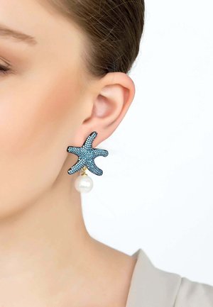 Blue starfish-shaped earrings with crystal detailing, featuring a single white pearl drop, attached to a gold-toned metal base.