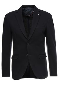 Blazer nero con finitura texture, rever a punta, due bottoni e una tasca sul petto. L'interno presenta una fodera liscia con colori di accento.
