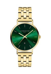 Goldfarbene Armbanduhr mit rundem Gehäuse und grünem Farbverlauf- Zifferblatt. Ausgestattet mit dünnen Stundenmarkierungen, goldenen Zeigern und einem massiven Metallarmband.