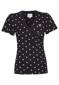Svart kortärmad topp med vita prickar och V-ringning. Har subtila volanger på sidan och en liten broderad logotyp.