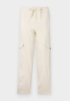 Beige cargo pants with a drawstring waist, featuring two side pockets and stitched detailing. Made of lightweight cotton material.