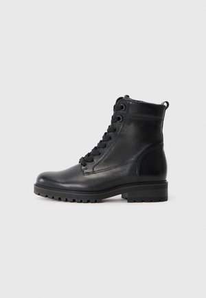 Black leather ankle boots with a rounded toe, lace-up front, and low rubber heel. Features smooth texture and a pull tab at the back.