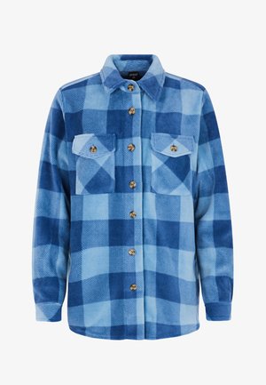 Blue checkered flannel shirt in varying shades of blue, featuring two chest pockets, embossed buttons, long sleeves, and a classic collar.